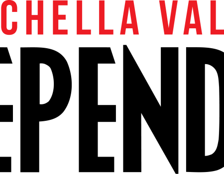 A black poster with red text at the top reading &ldquo;COACHELLA VALLEY,&rdquo; set against a dark background.